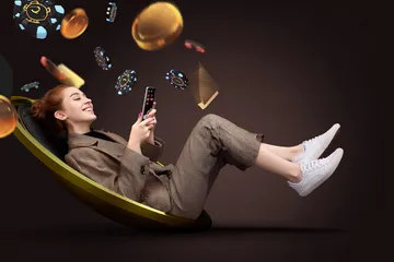 A player using their smartphone during a festive local event, representing SOUL776’s fully mobile-friendly casino.